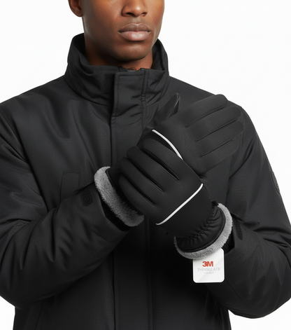 Person wearing black gloves with gray cuffs and a black jacket, featuring the 3M logo.
