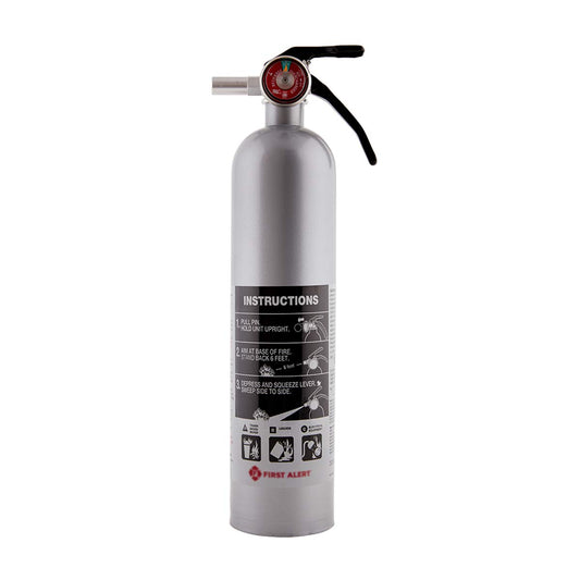 Silver fire extinguisher with black label on a white background