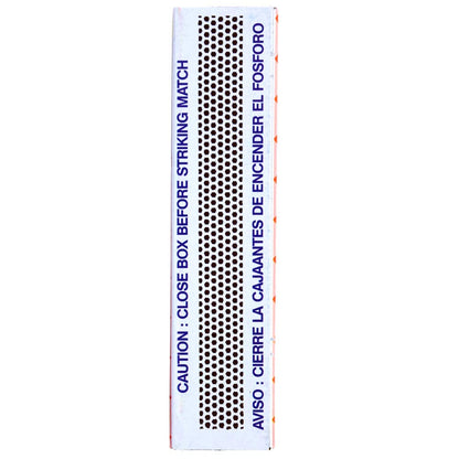 Close-up of matchbox striker strip with safety warning text for striking matches safely and preventing accidental ignition
