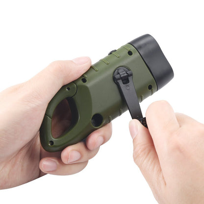 Green flashlight held in a hand with a white background